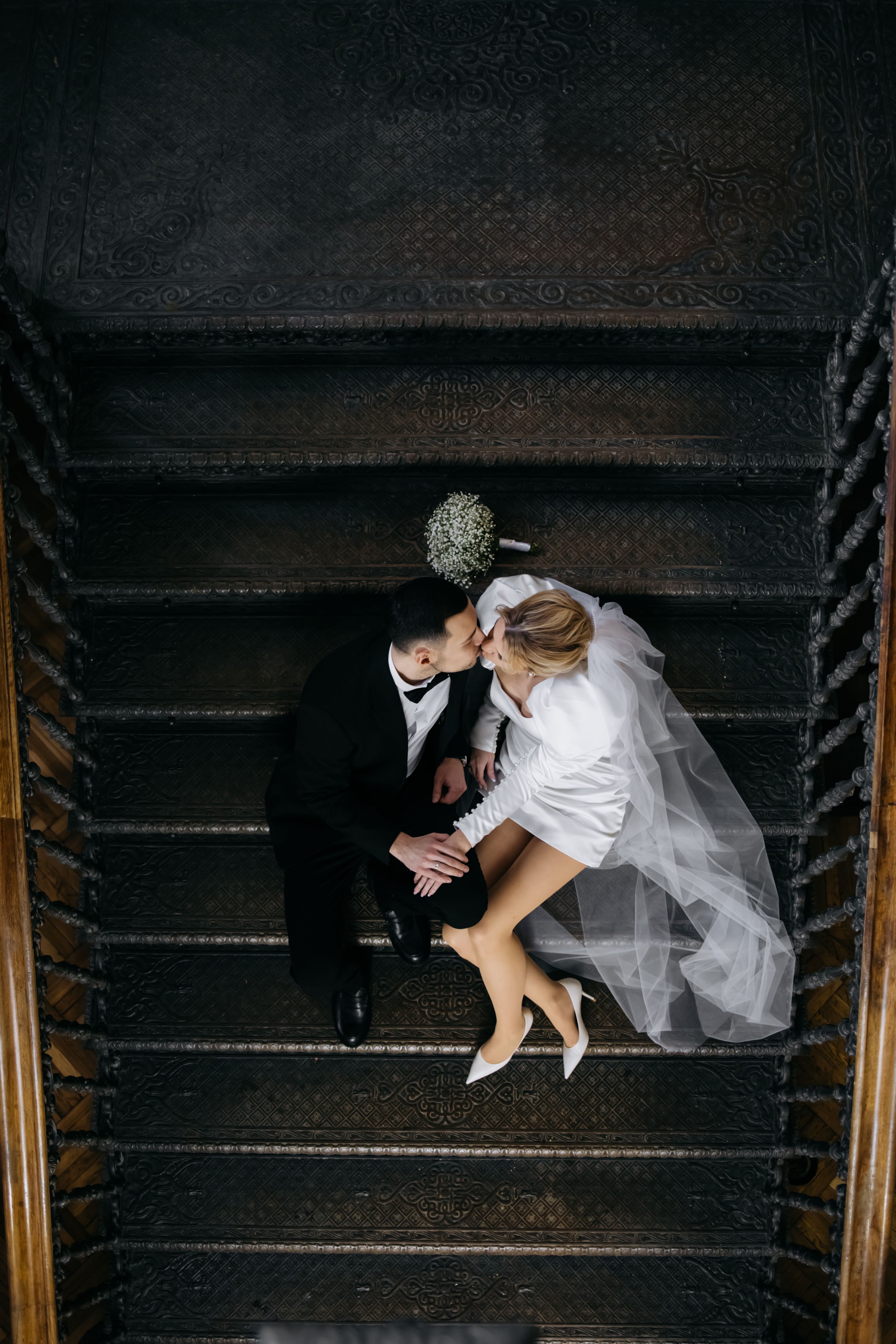 Couple on an ornate staircase